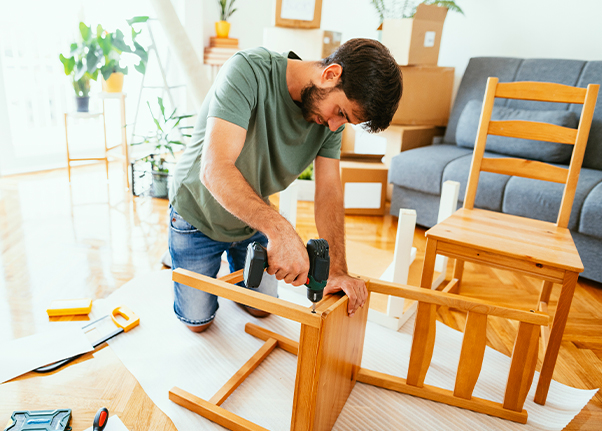 Property Owner building a wooden chair in a rental property