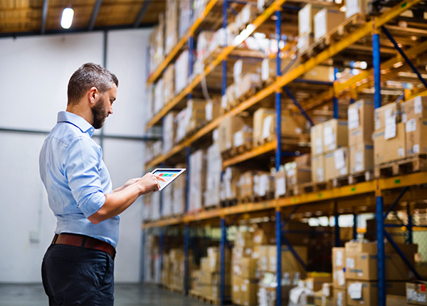 Man using tablet in warehouse